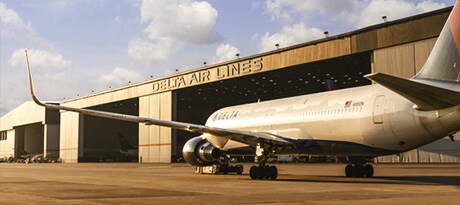Delta jet in front of hangar