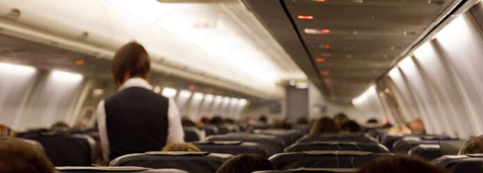 Flight attendant in plane