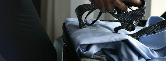 Man packing suitcase