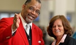 Red Coat employee giving assist