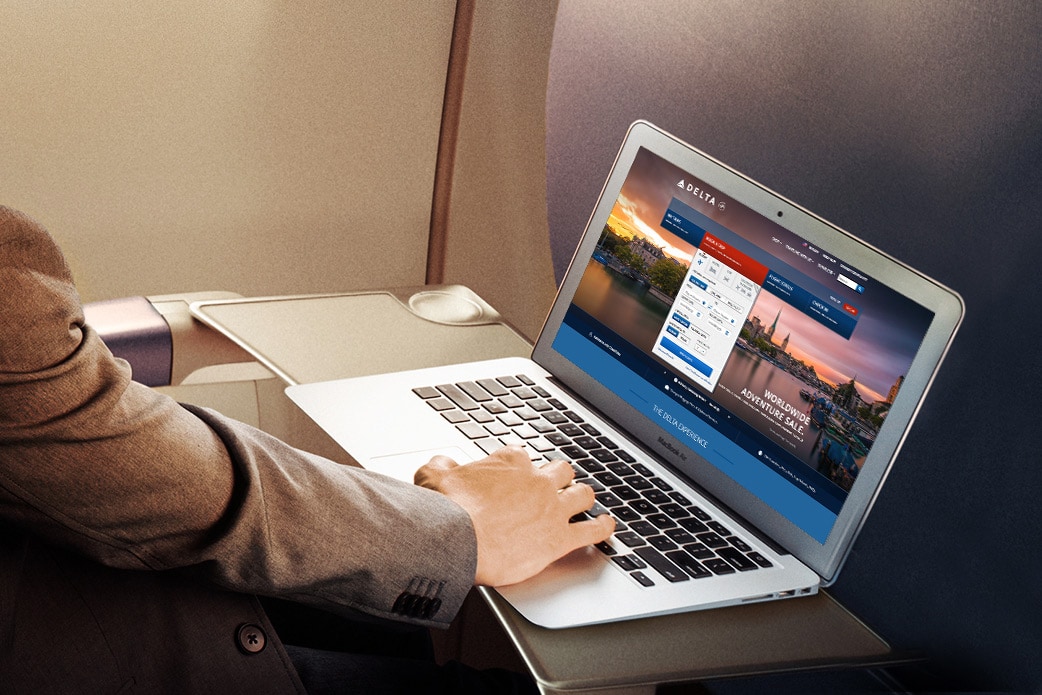 Customer watching tablet on plane
